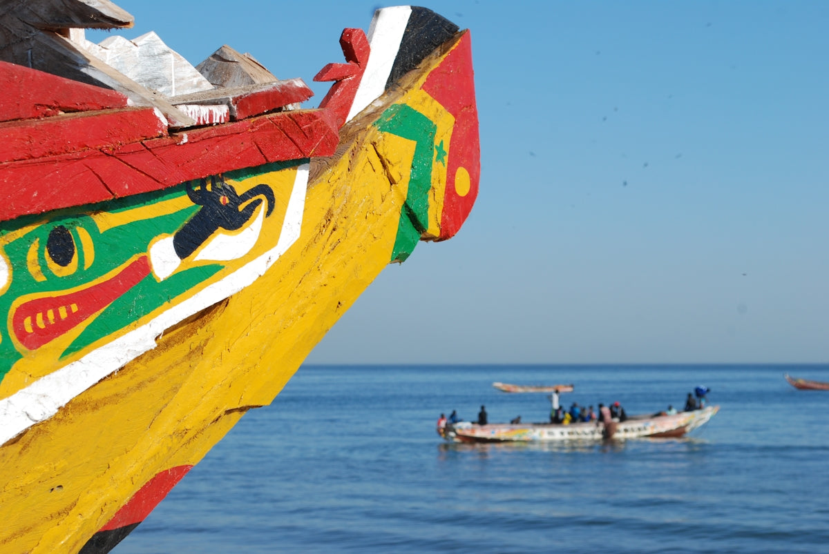 a group of boats floating on top of a large body of water