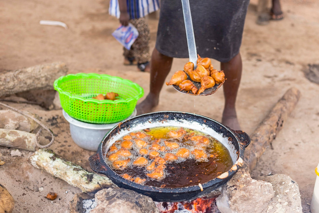 a person cooking food on a grill