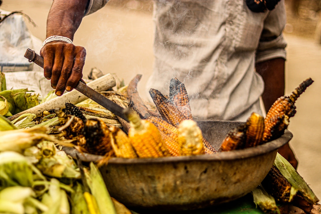 a person holding a large pot of food