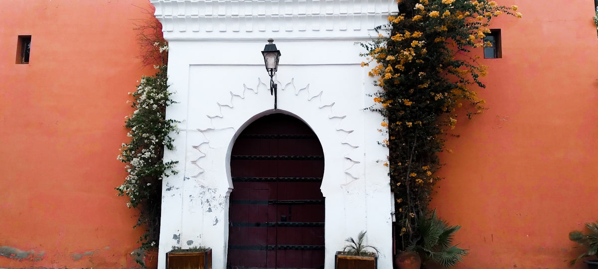 a red and white building with a red door
