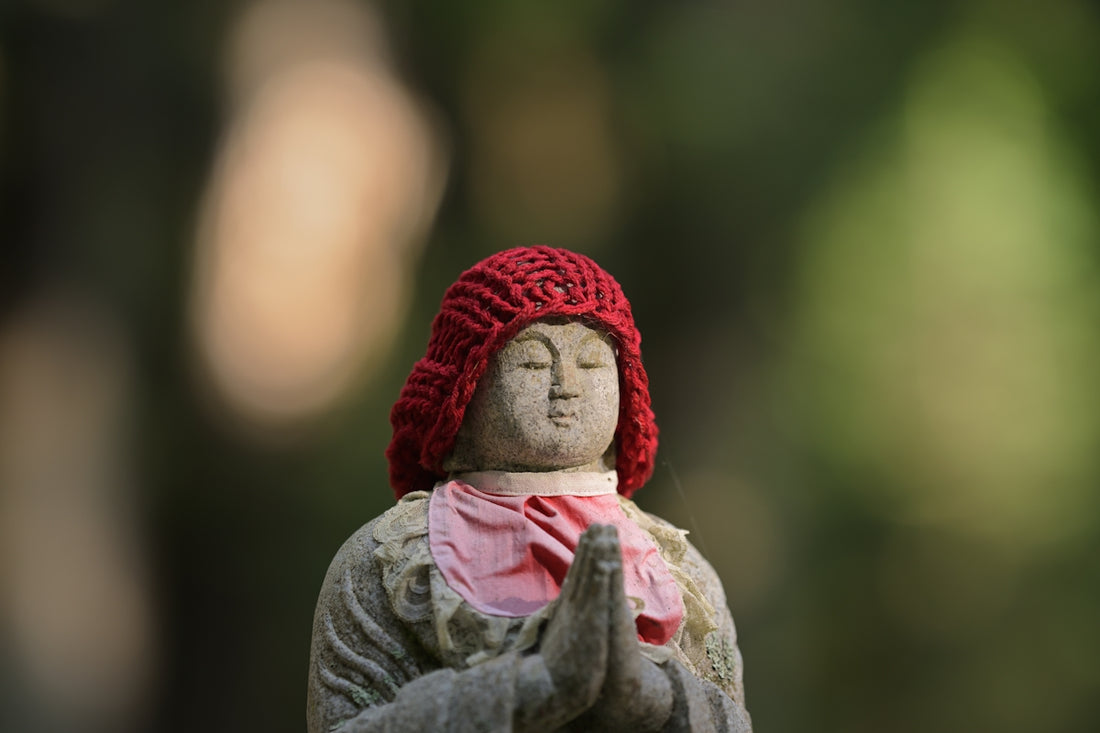 A statue of a woman wearing a red hat
