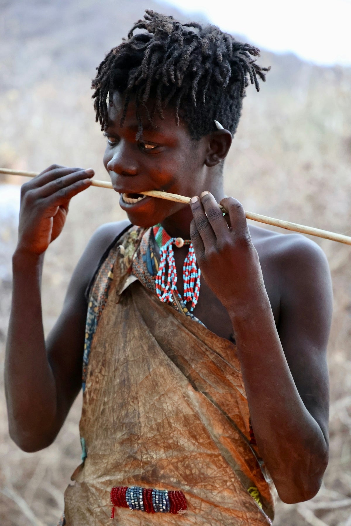 A woman with a stick in her hand
