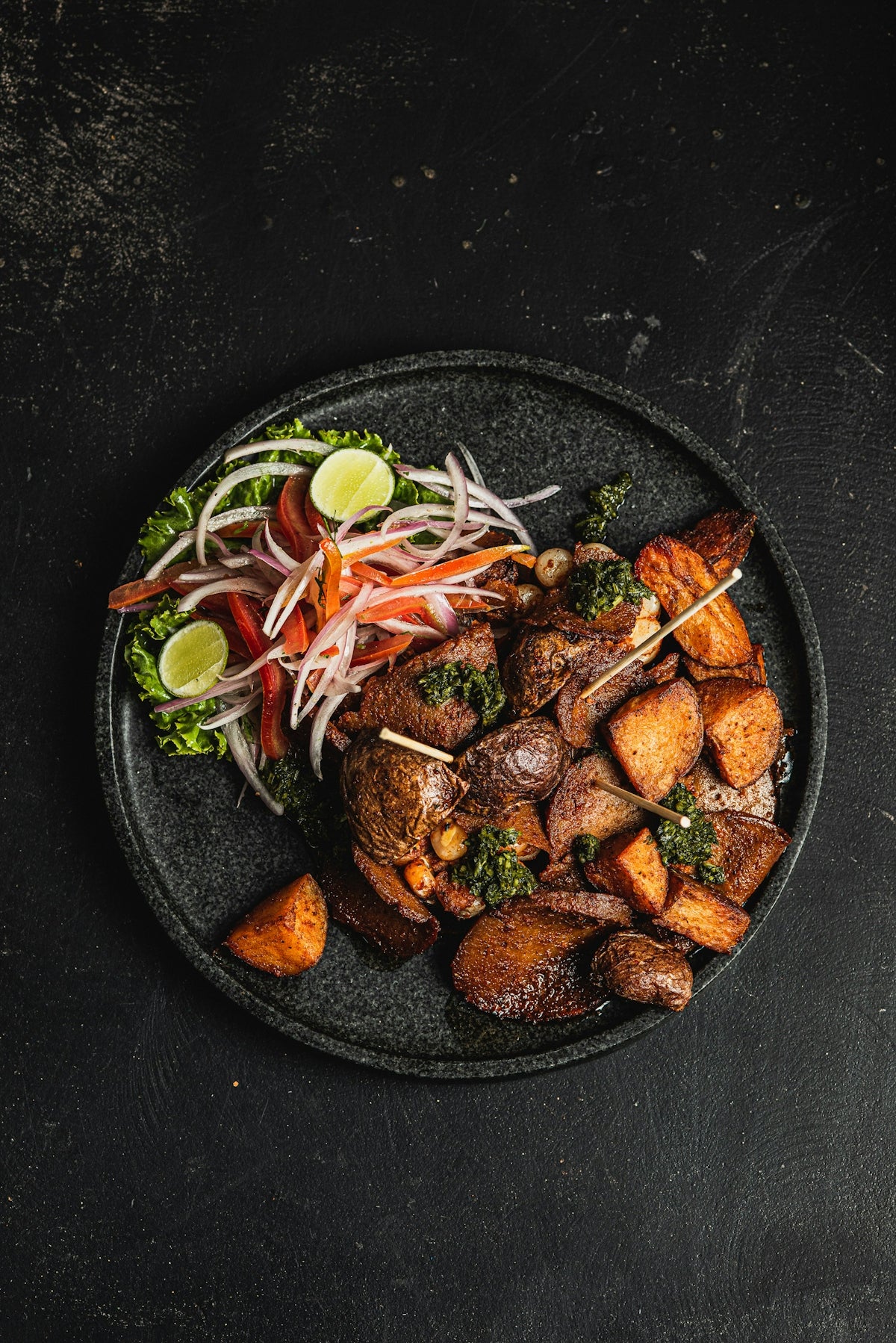 Grilled meat with roasted potatoes and salad