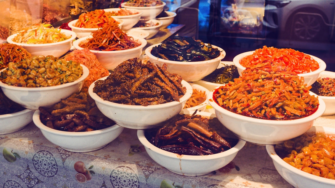 Bowls of assorted pickled vegetables and food